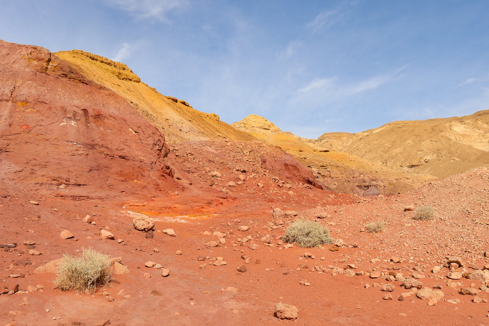 Red and gold rock formations in the Makhtesh